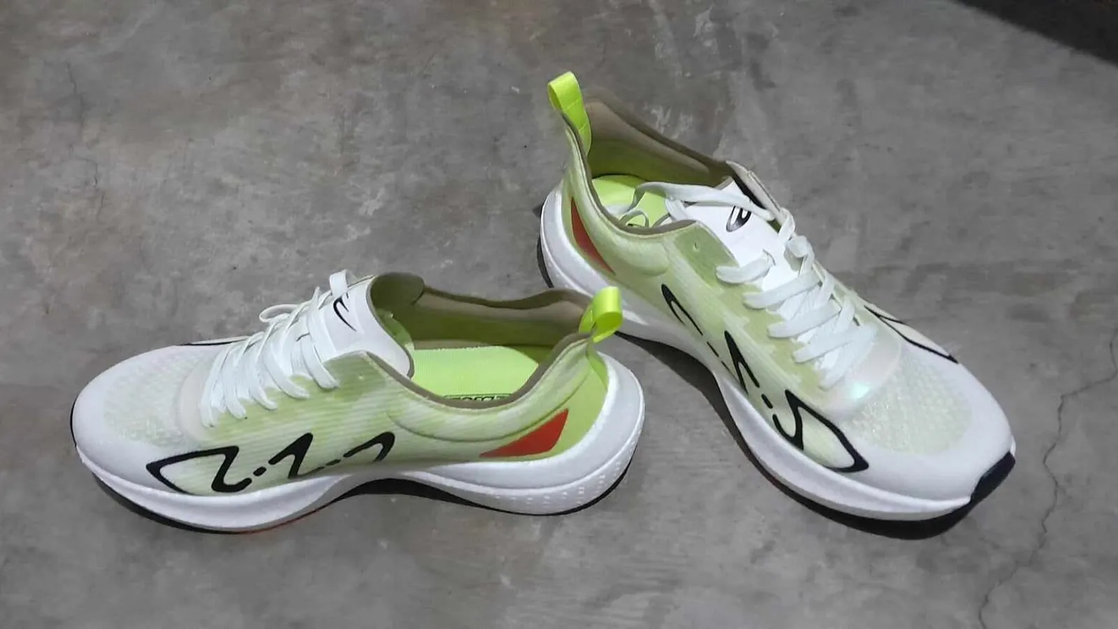 A pair of running shoes photographed from the side