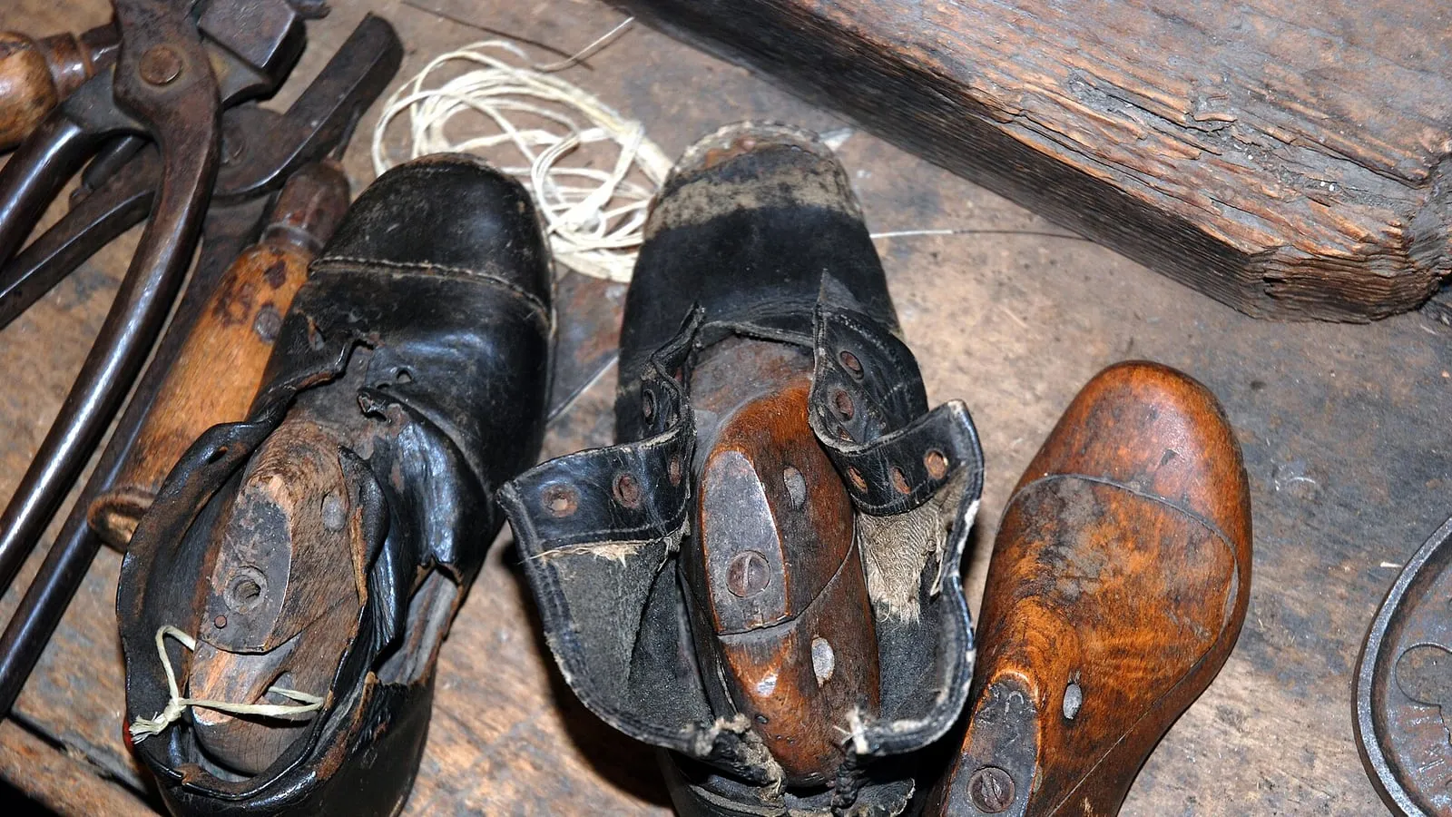 A shoe on a wooden last in a workshop