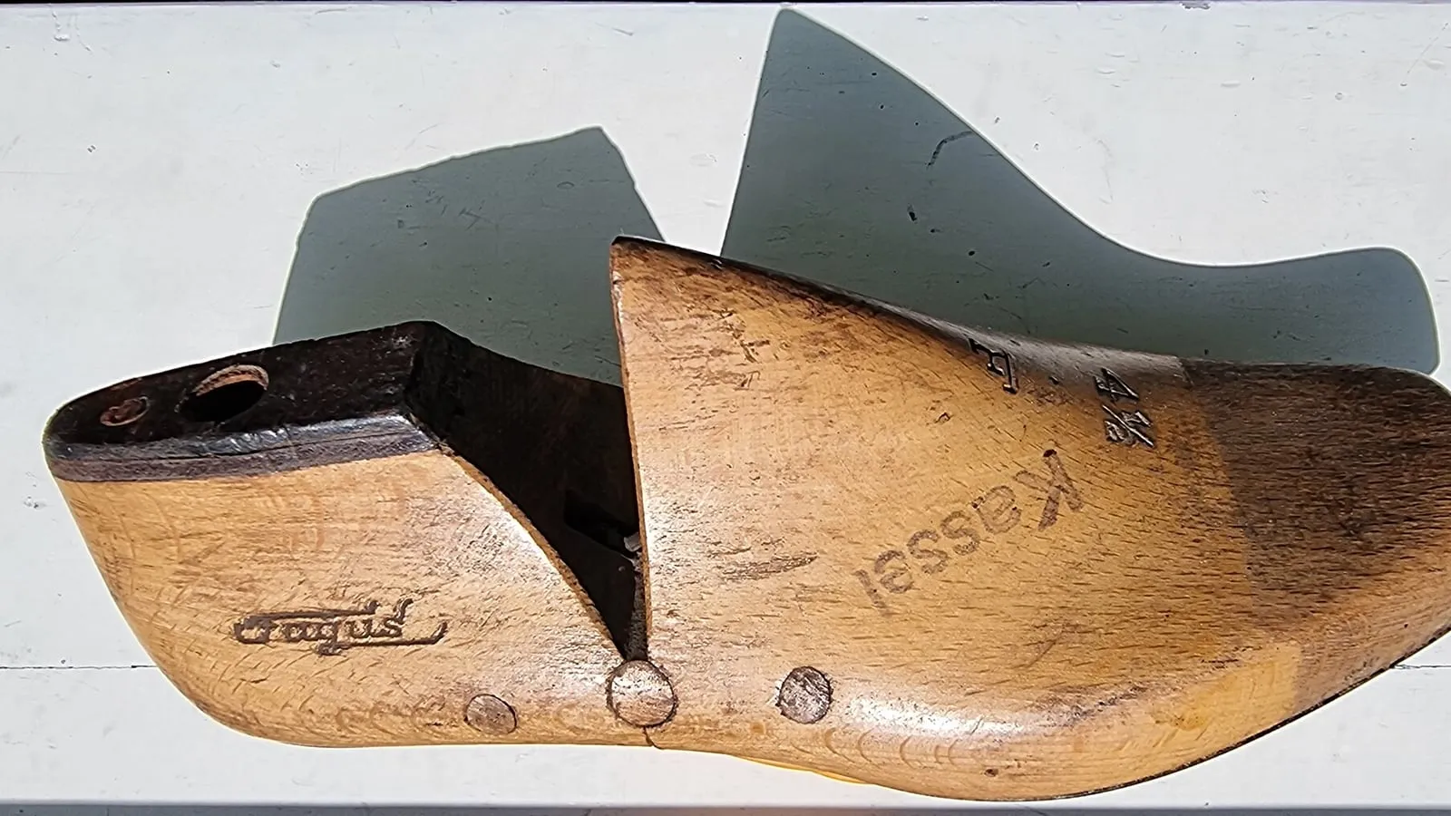 A hinged wooden shoe last showing the width and toe shape